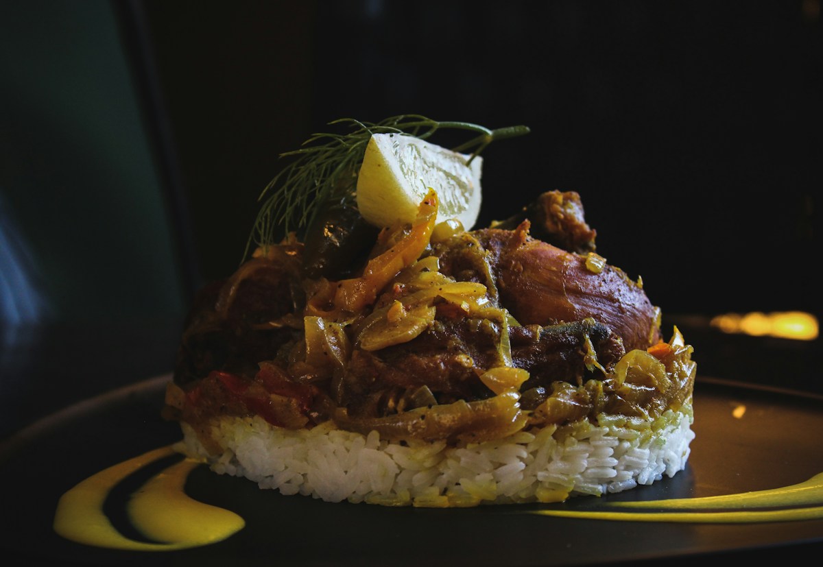 A bowl of tender, fragrant steamed white Thai jasmine rice fluffed with a fork